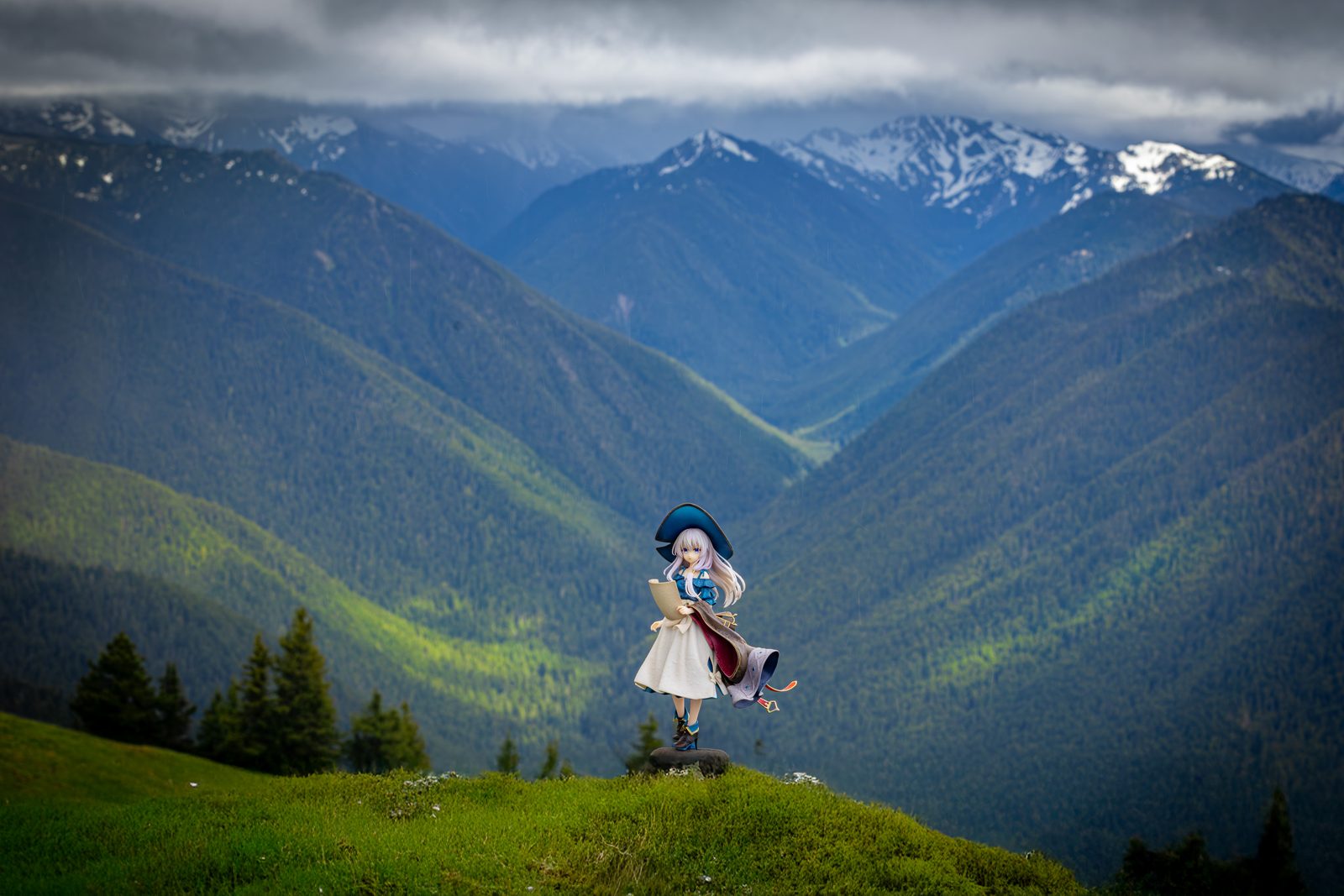 Figure on green hillside