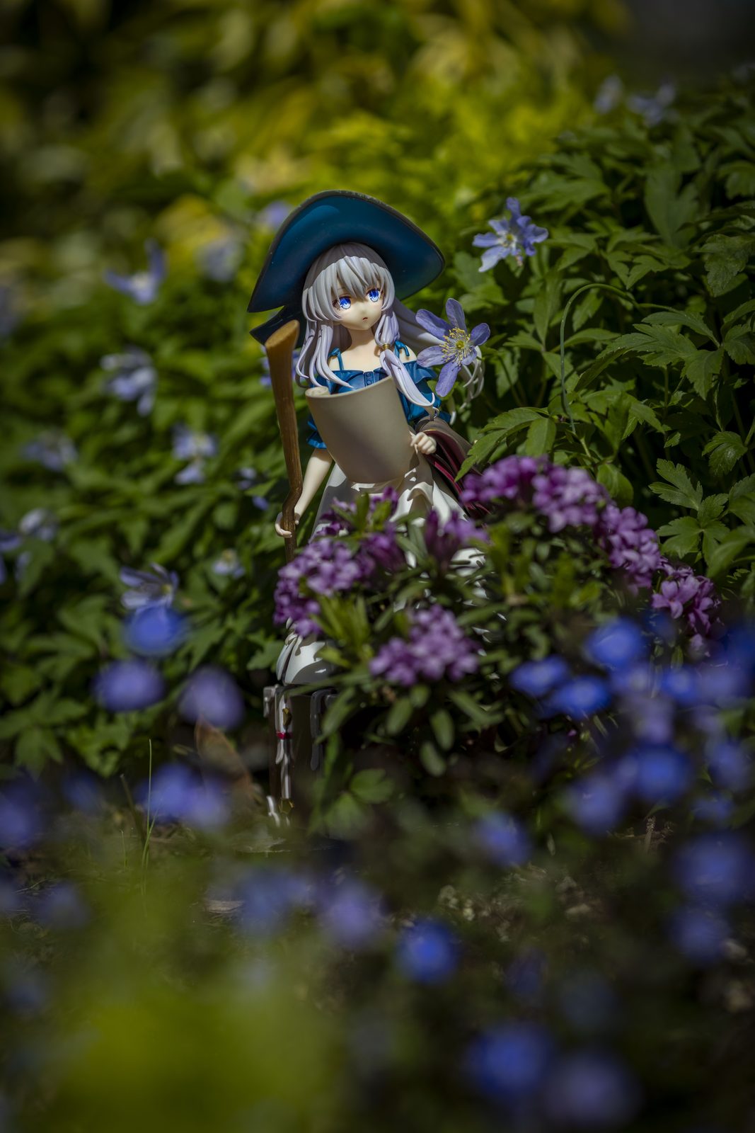 Figure among purple flowers